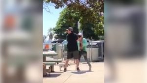 still from video of the attack showing the woman arguing with the man