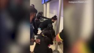 still from footage of brawl at Fort Lauderdale International Airport