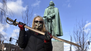 Cindy Gaylord, chairwoman of the Westfield Historical Commission, holding the original sword from the statue of Gen. William Shepard which stands near the town green in the center of Westfield, Mass.
