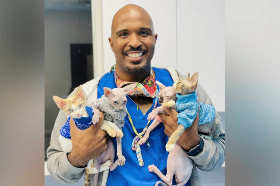 Florida vet Prentiss Madden in vets uniform holding animals