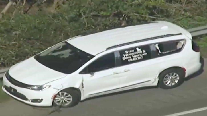 white mortuary van allegedly stolen by Kijon Griffin to make a getaway from cops